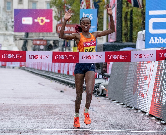 Brigid Kosgei of Kenya celebrates as she crosses the finish line to win the Elite Women's Race at the London Marathon 2020 in central London, Britain, on Oct. 4, 2020.