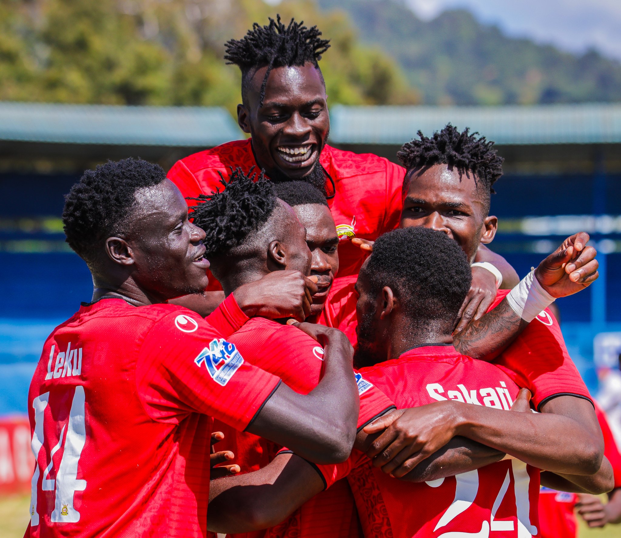 Police FC Players celebrating a goal.