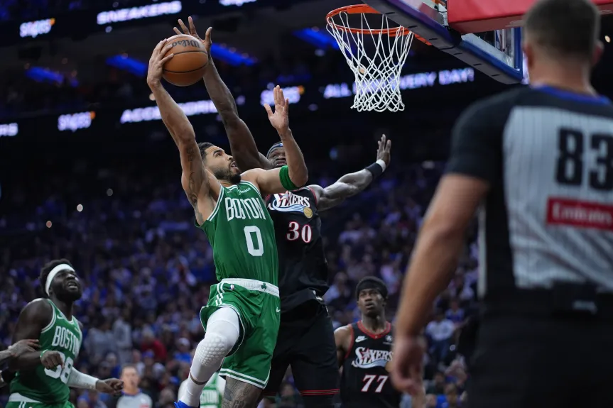 Boston Celtics’ Jayson Tatum, left, goes up for a shot against Philadelphia 76ers’ Adem Bona during the first half of Game 3 in a first-round NBA playoff series Friday in Philadelphia. (AP Photo/Matt Slocum)